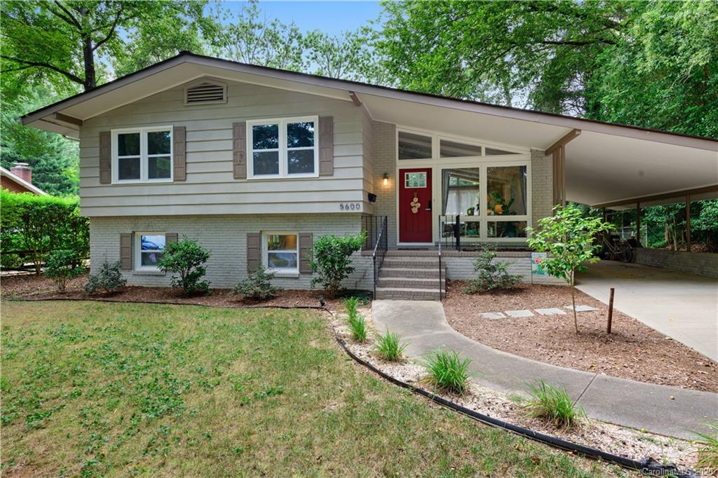 5600 Seacroft Road Charlotte, NC 28210 - Photo 1 of 18 a front view of a house with garden