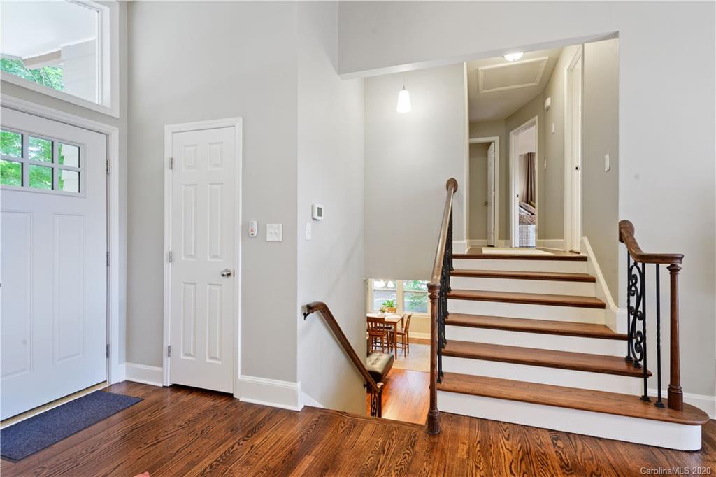 5600 Seacroft Road Charlotte, NC 28210 - Photo 11 of 18 a view of entryway with wooden floor and stairs