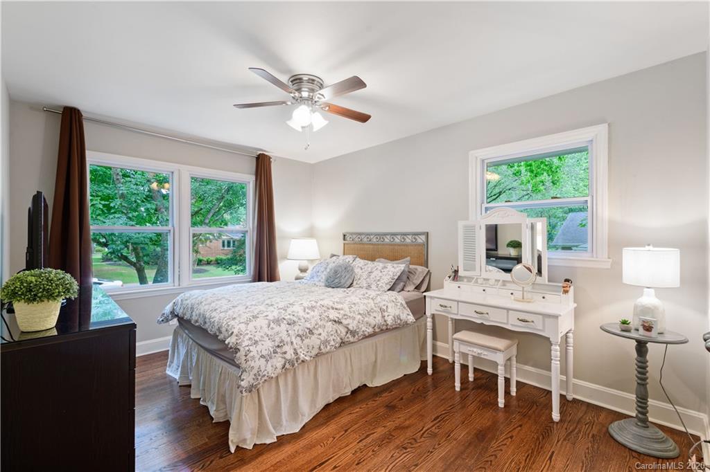 5600 Seacroft Road Charlotte, NC 28210 - Photo 13 of 18 a bedroom with a bed and a table