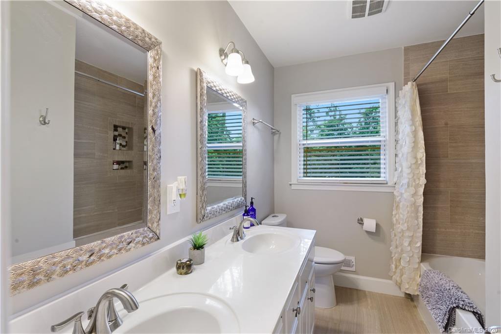 5600 Seacroft Road Charlotte, NC 28210 - Photo 15 of 18 a bathroom with a sink vanity mirror and toilet