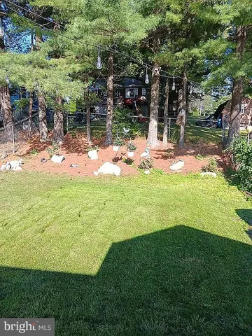 a view of a house with a big yard