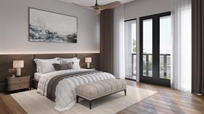 2106 Stuart Street Houston, TX 77004 - Photo 4 of 11 a bedroom with a large bed and a painting on the wall