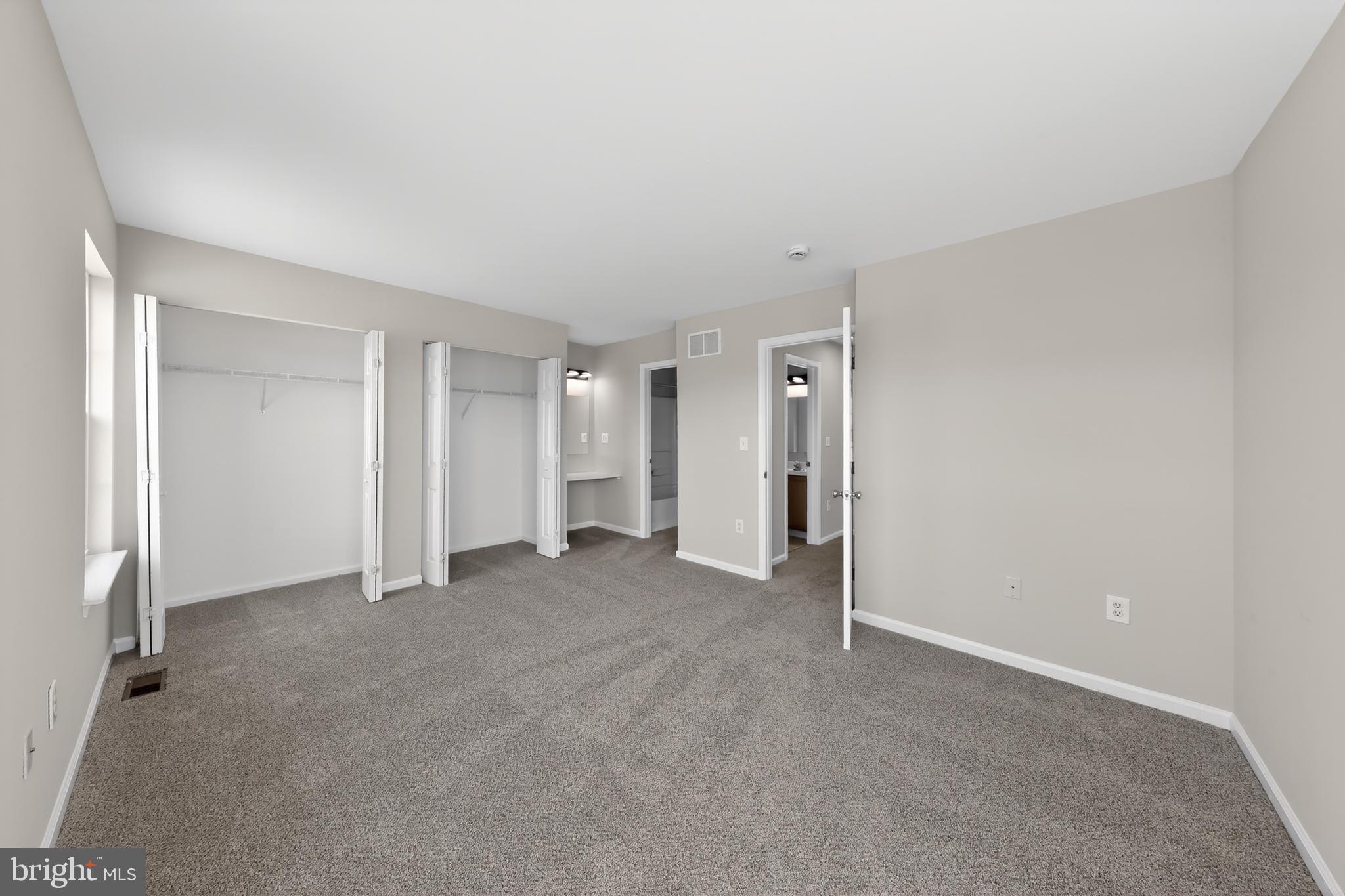 390 Addison Road Smyrna, DE 19977 - Photo 18 of 26 Spacious primary bedroom with good closet spaces