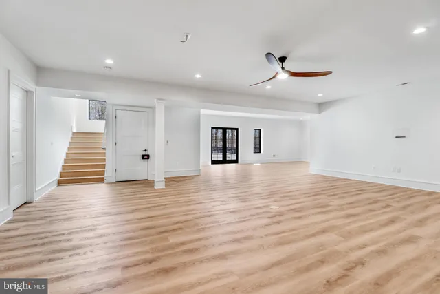 a view of a kitchen with a sink and refrigerator