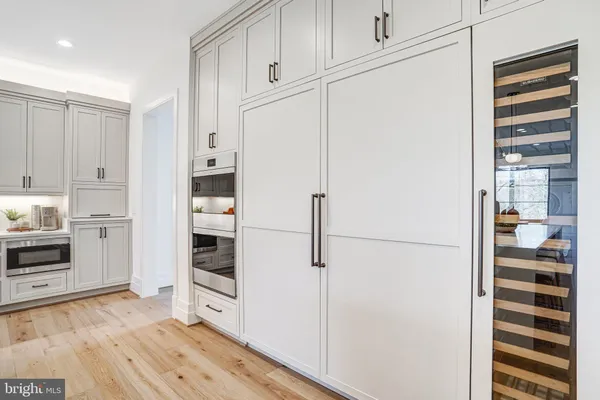 a spacious bathroom with a double vanity sink and a mirror