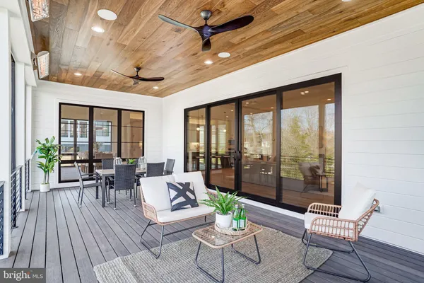 a bedroom with a bed mirror and window