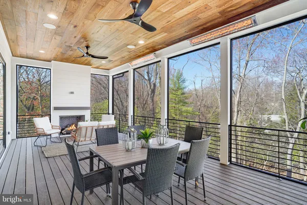 a view of a room with wooden floor closet and windows