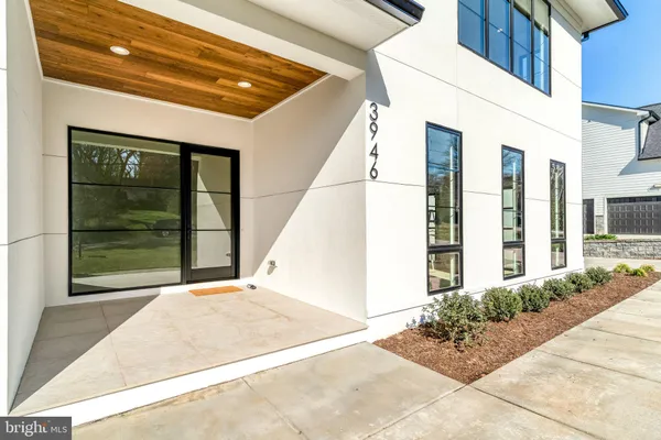 a view of a livingroom with wooden floor and staircase