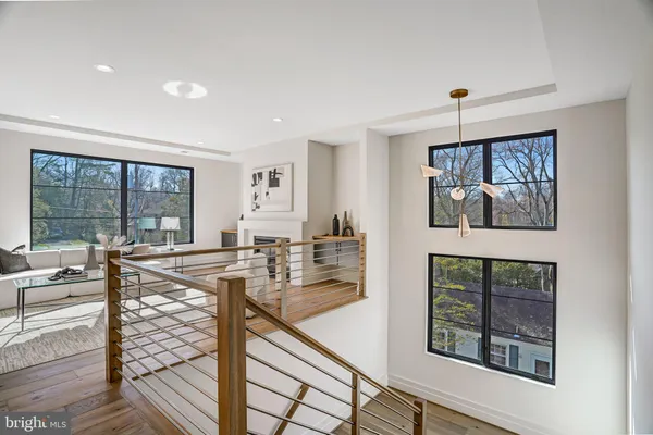 a bathroom with a bathtub shower sink vanity mirror and toilet