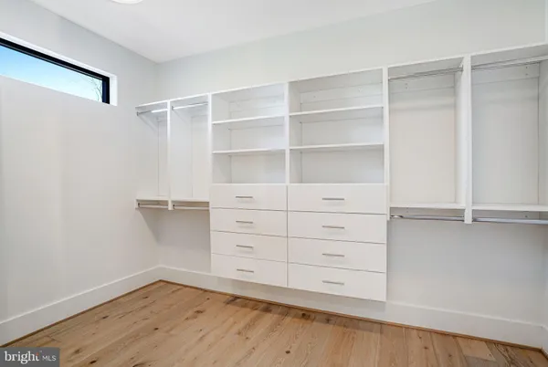 a front view of a building with a yard