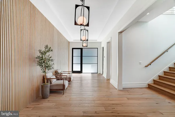 a living room with furniture large window and fireplace