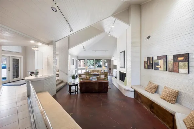 a room with gym equipment and mirror