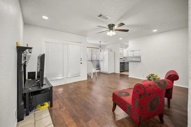 a kitchen with stainless steel appliances a refrigerator and a stove top oven