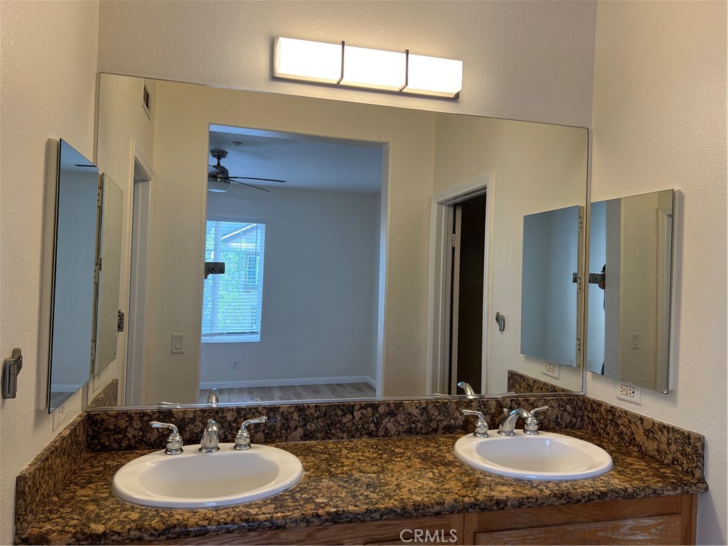 2243 Strickler Drive Fullerton, CA 92833 - Photo 16 of 20 a bathroom with a sink and a mirror