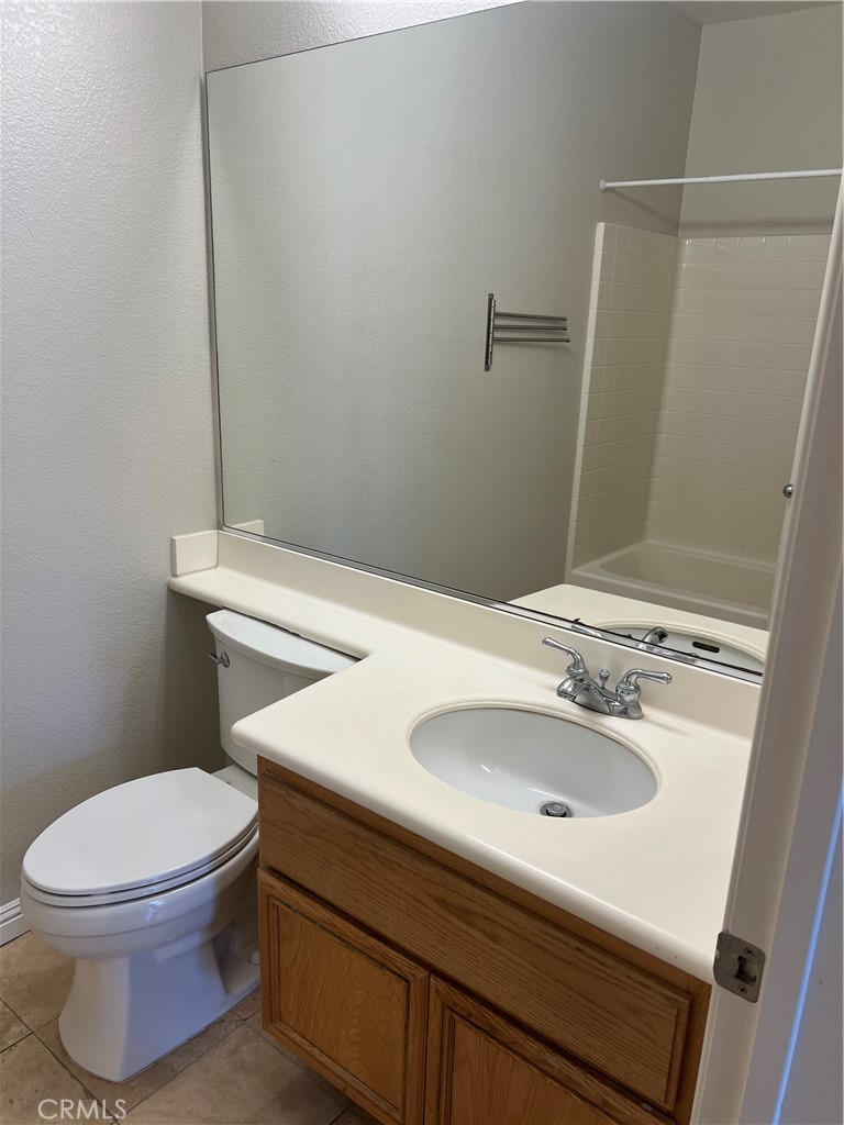 2243 Strickler Drive Fullerton, CA 92833 - Photo 18 of 20 a bathroom with a sink toilet and mirror