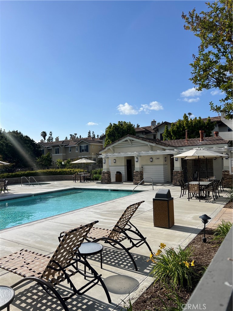 2243 Strickler Drive Fullerton, CA 92833 - Photo 20 of 20 a view of a swimming pool with lounge chairs in patio