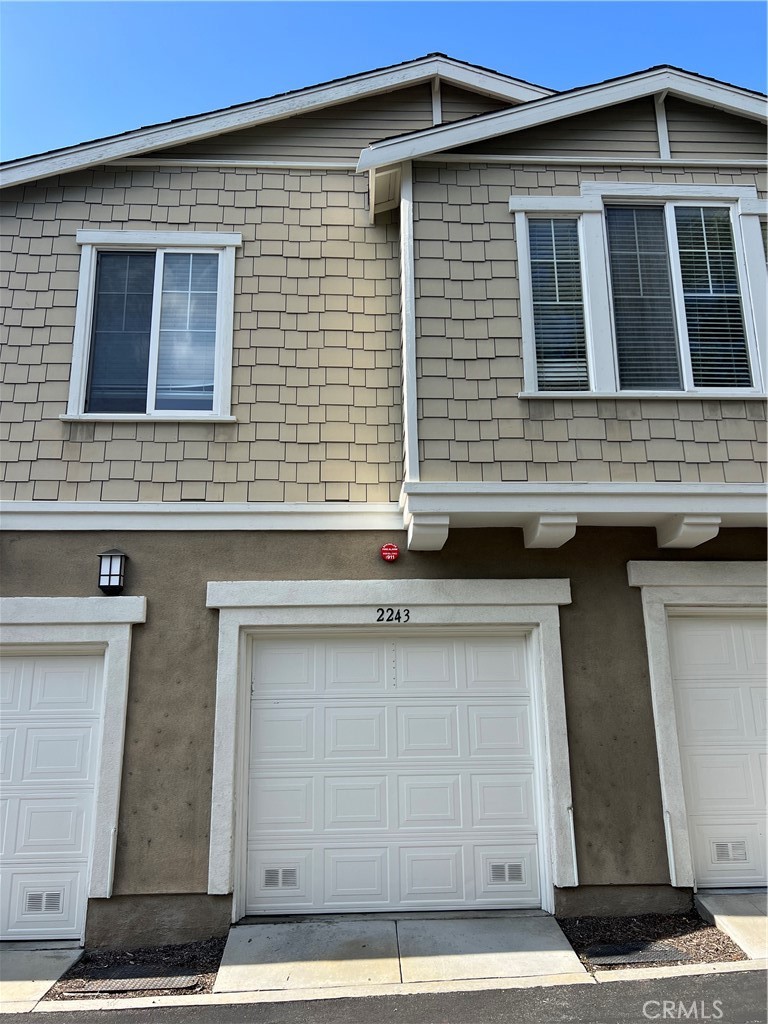 2243 Strickler Drive Fullerton, CA 92833 - Photo 3 of 20 a front view of a house with garage