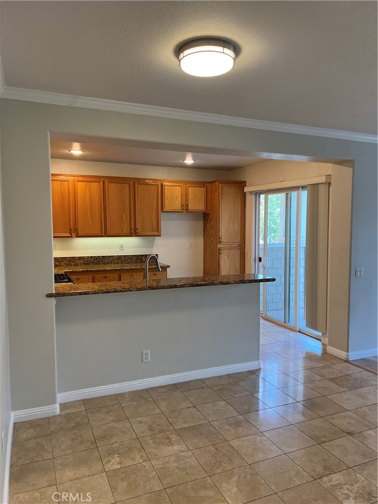 2243 Strickler Drive Fullerton, CA 92833 - Photo 8 of 20 a view of kitchen with granite countertop cabinets and outdoor space