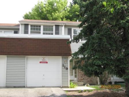 119 Julie Road, Unit 127 Bolingbrook, IL 60440 - Photo 1 of 1 a front view of a house with a garden