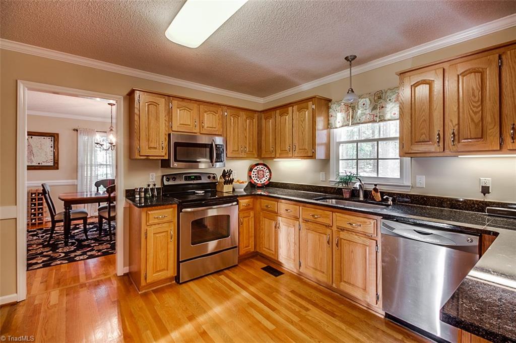 5553 Woodstream Road Randleman, NC 27317 - Photo 8 of 30 Stainless appliance and new granite countertops