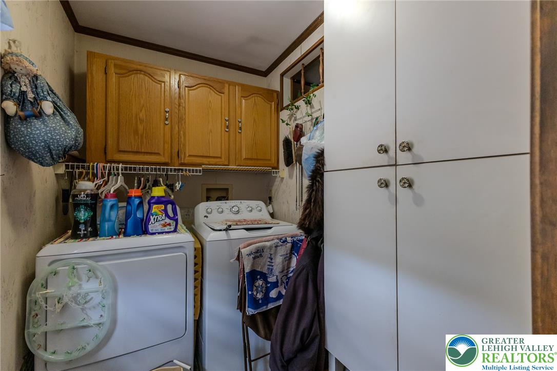 40 Locke Heights Road Bangor, PA 18013 - Photo 25 of 28 Functional utility space with ample cabinetry provides convenient laundry solutions for any household.