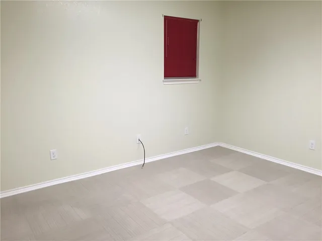 a view of a room with wooden floor and wooden floor