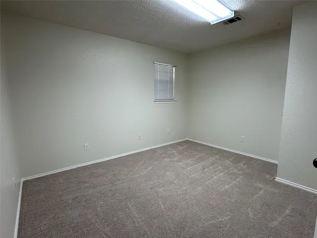 a large kitchen with stainless steel appliances granite countertop a stove sink and cabinets