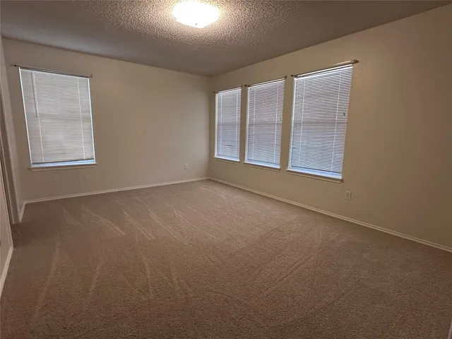 a kitchen with stainless steel appliances granite countertop a sink and dishwasher a refrigerator with wooden cabinets