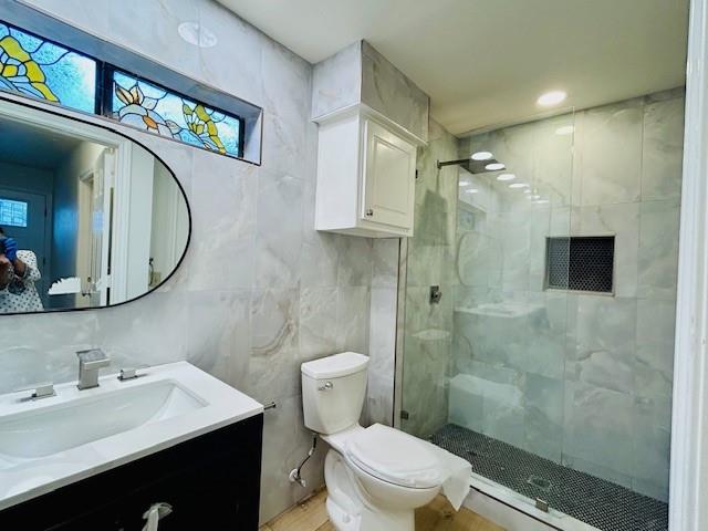 17119 Upper Bay Road Addison, TX 75001 - Photo 14 of 29 a bathroom with a sink a toilet and a mirror