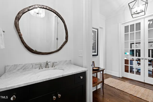 a bathroom with a sink and a mirror