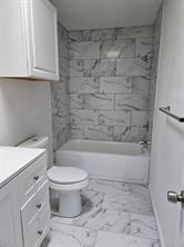 807 Wind Brooke Drive Arlington, TX 76001 - Photo 13 of 13 a bathroom with a toilet and a shower