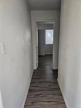 807 Wind Brooke Drive Arlington, TX 76001 - Photo 7 of 13 a view of a hallway with wooden floor and a staircase