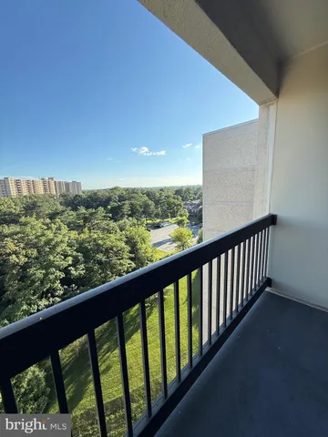 a view of balcony with wooden floor