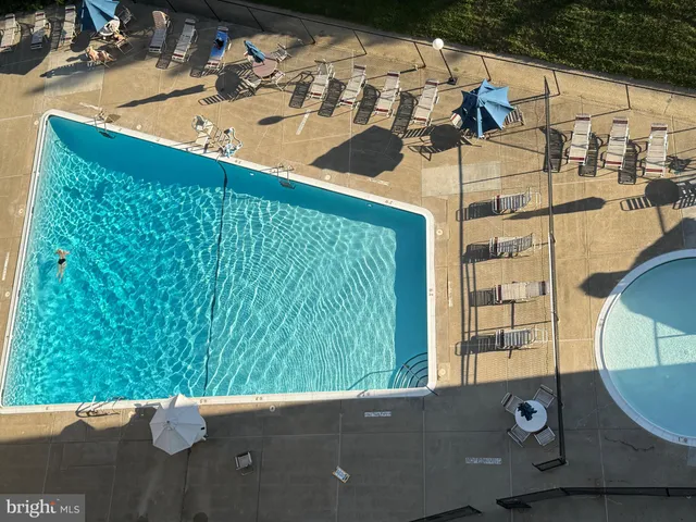 an empty room with a empty space and windows