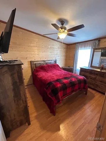 a bedroom with a bed and window