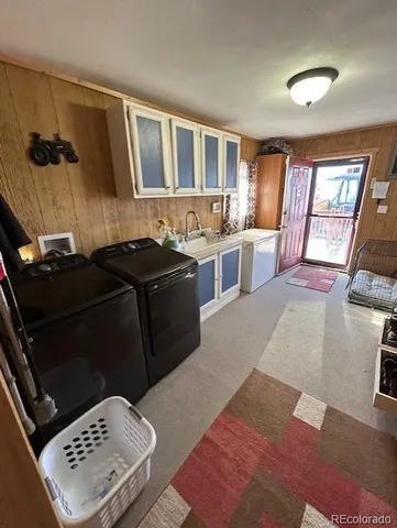 a kitchen with a sink and a stove top oven