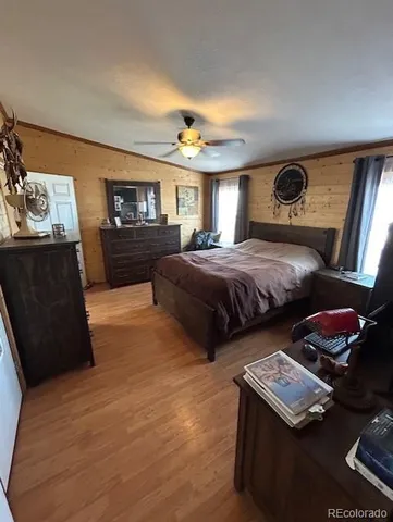 a bedroom with bed and window