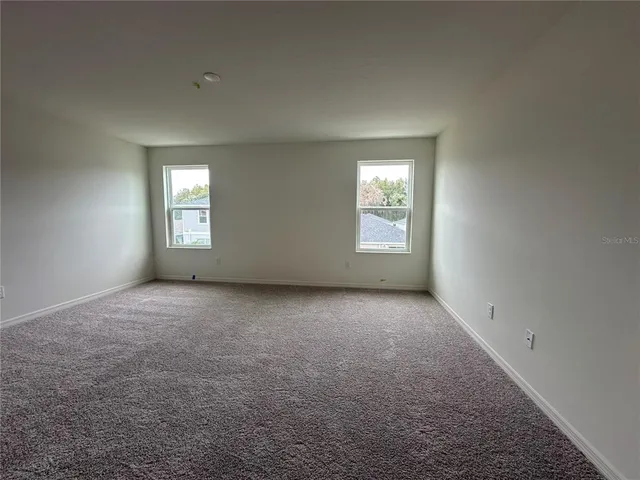 a house view with a backyard space