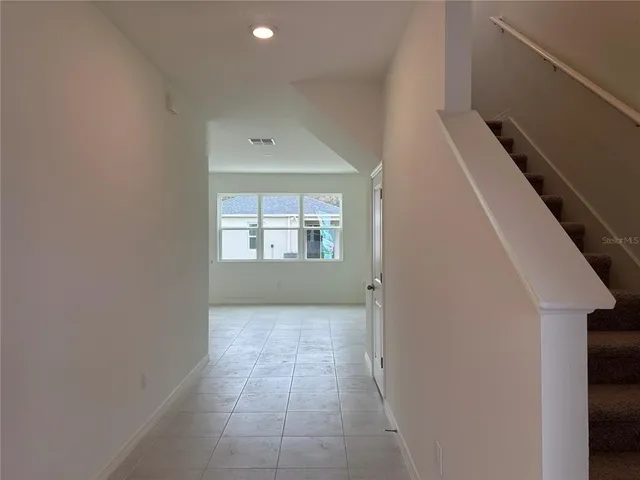 a kitchen with stainless steel appliances granite countertop a sink stove and microwave