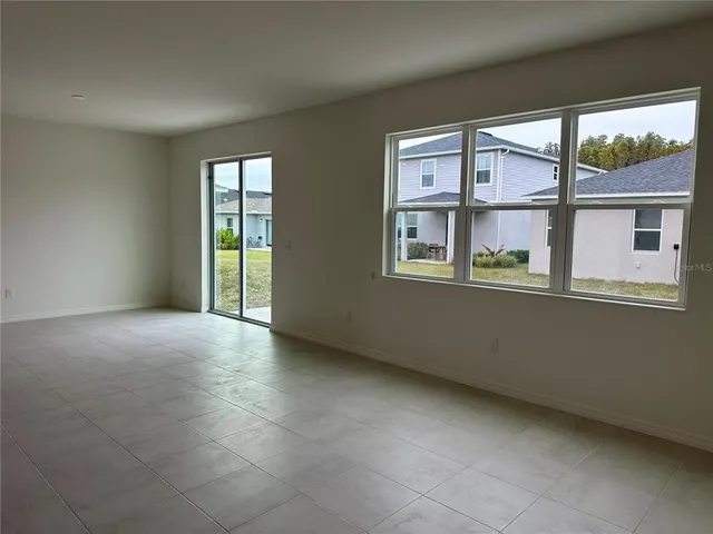 a view of kitchen with stainless steel appliances granite countertop a sink