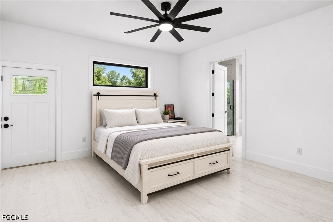 2665 Oil Well Road Naples, FL 34120 - Photo 17 of 40 a bedroom with a bed and a painting
