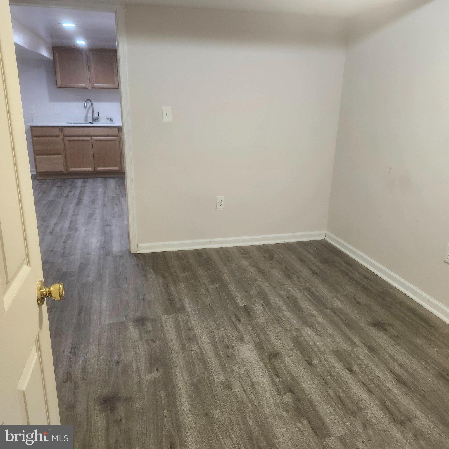 12505 Kingsview Street Bowie, MD 20721 - Photo 11 of 20 Spacious room with modern flooring.