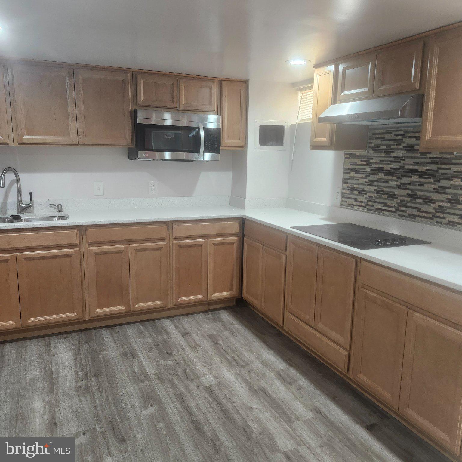 12505 Kingsview Street Bowie, MD 20721 - Photo 6 of 20 Modern kitchen with sleek finishes.