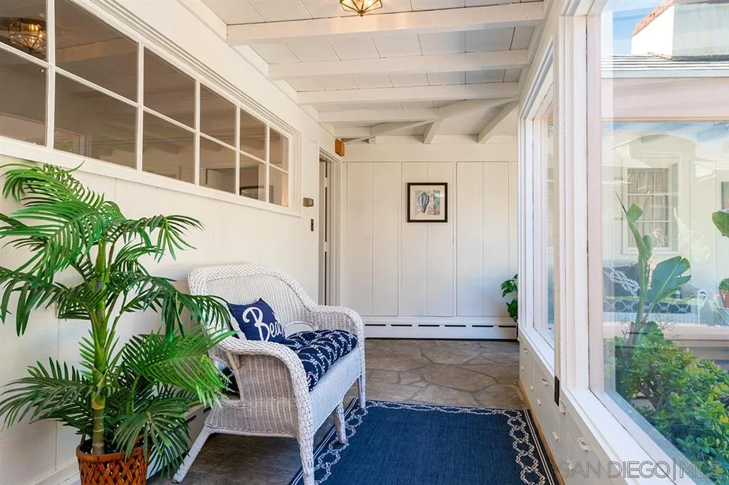 685 Ocean Boulevard Coronado, CA 92118 - Photo 11 of 16 a hallway with potted plants and wooden floor