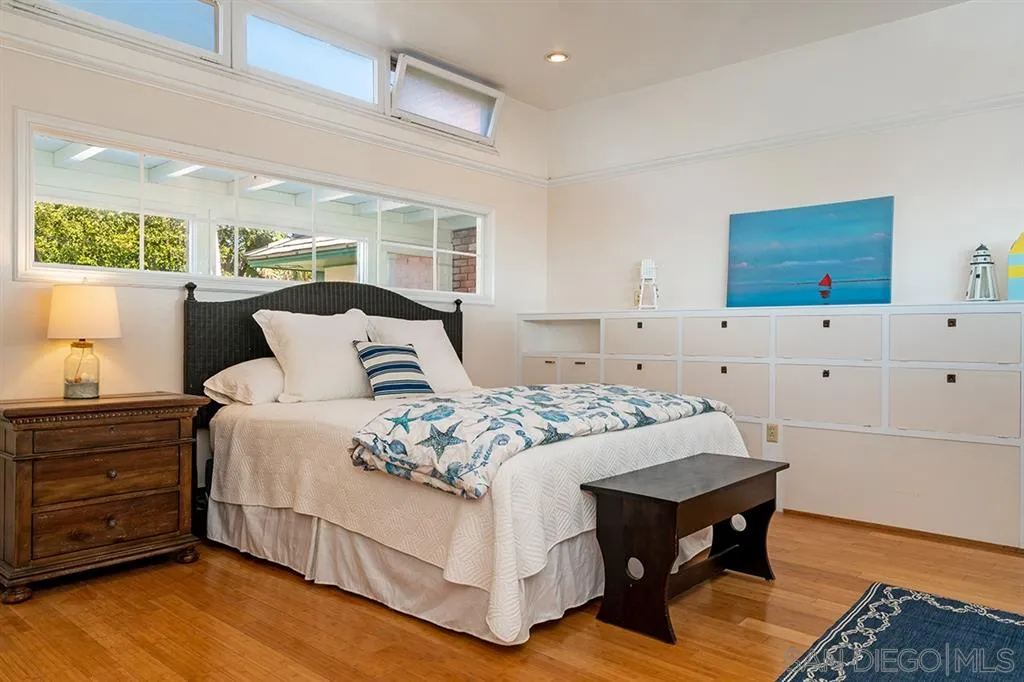685 Ocean Boulevard Coronado, CA 92118 - Photo 13 of 16 a bedroom with a bed and window