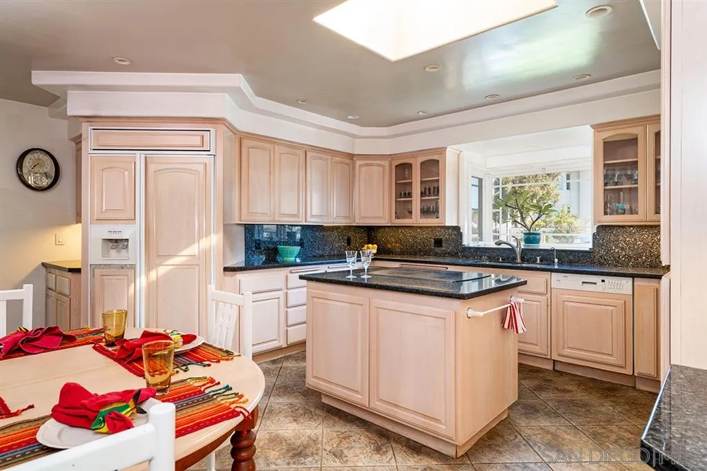 685 Ocean Boulevard Coronado, CA 92118 - Photo 8 of 16 a kitchen with stainless steel appliances granite countertop a sink stove and cabinets