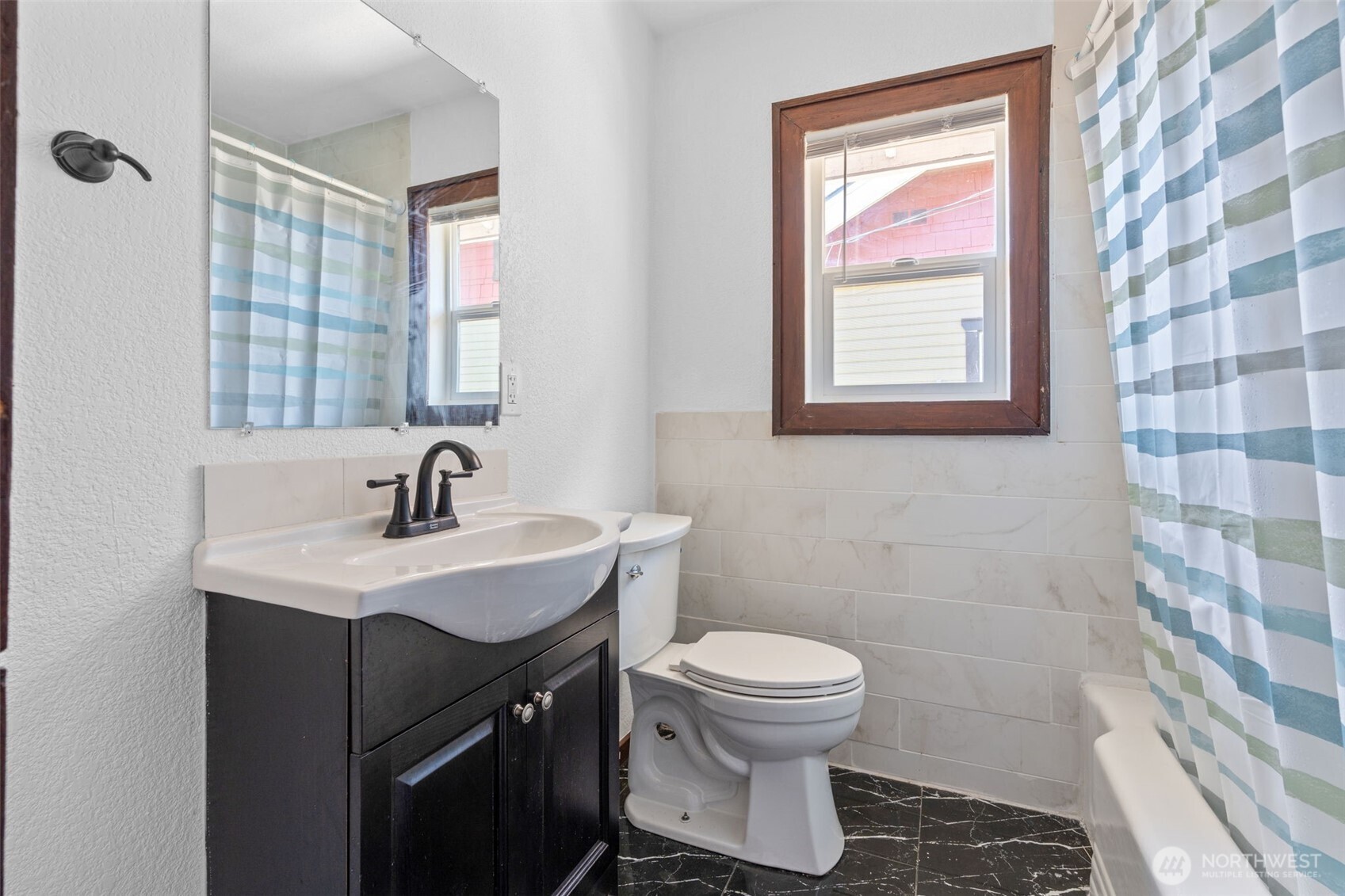 226 Southwest Lewis Street Chehalis, WA 98532 - Photo 20 of 27 a bathroom with a sink toilet and mirror