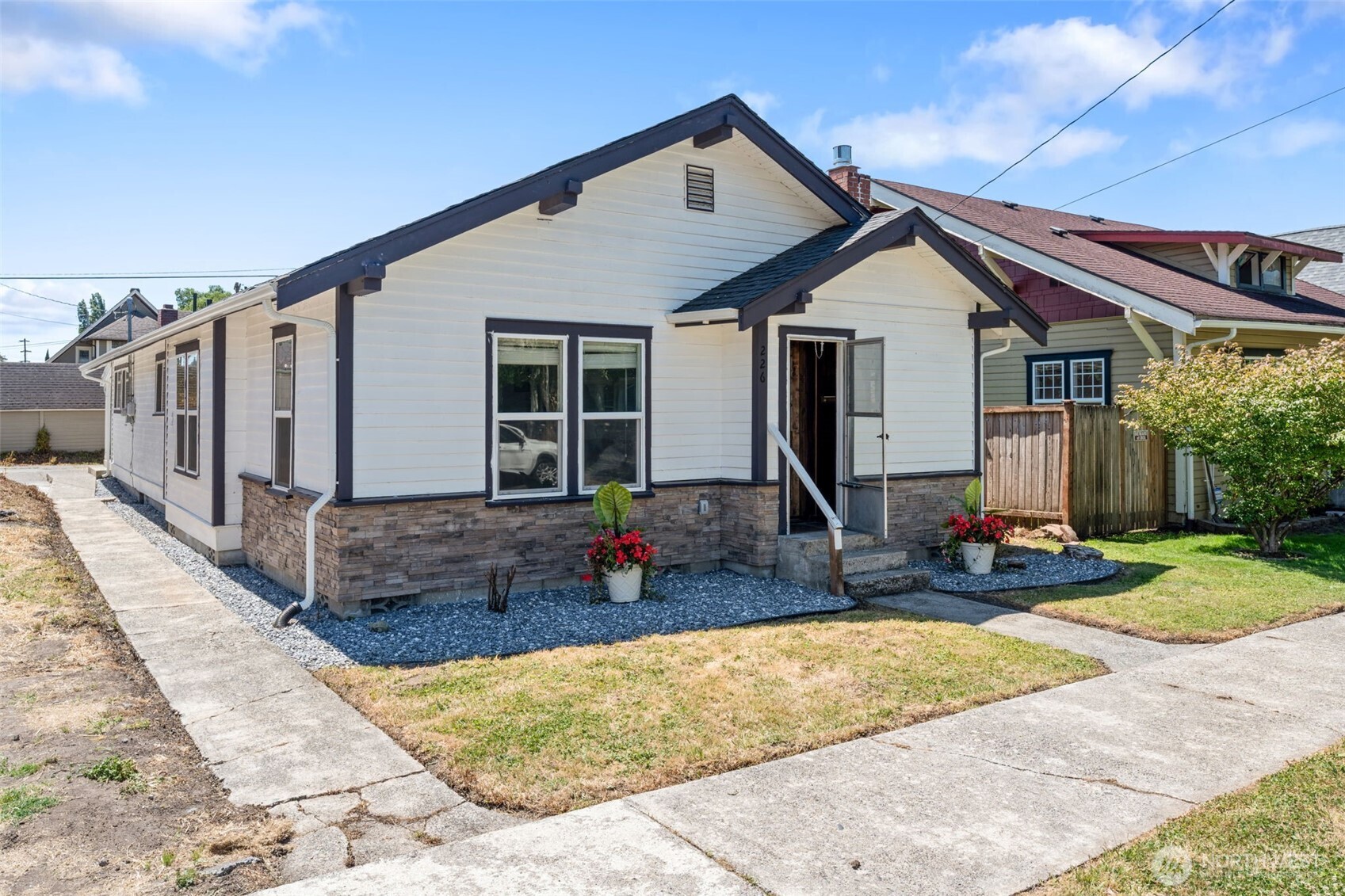 226 Southwest Lewis Street Chehalis, WA 98532 - Photo 2 of 27 a front view of house with yard outdoor seating and barbeque oven