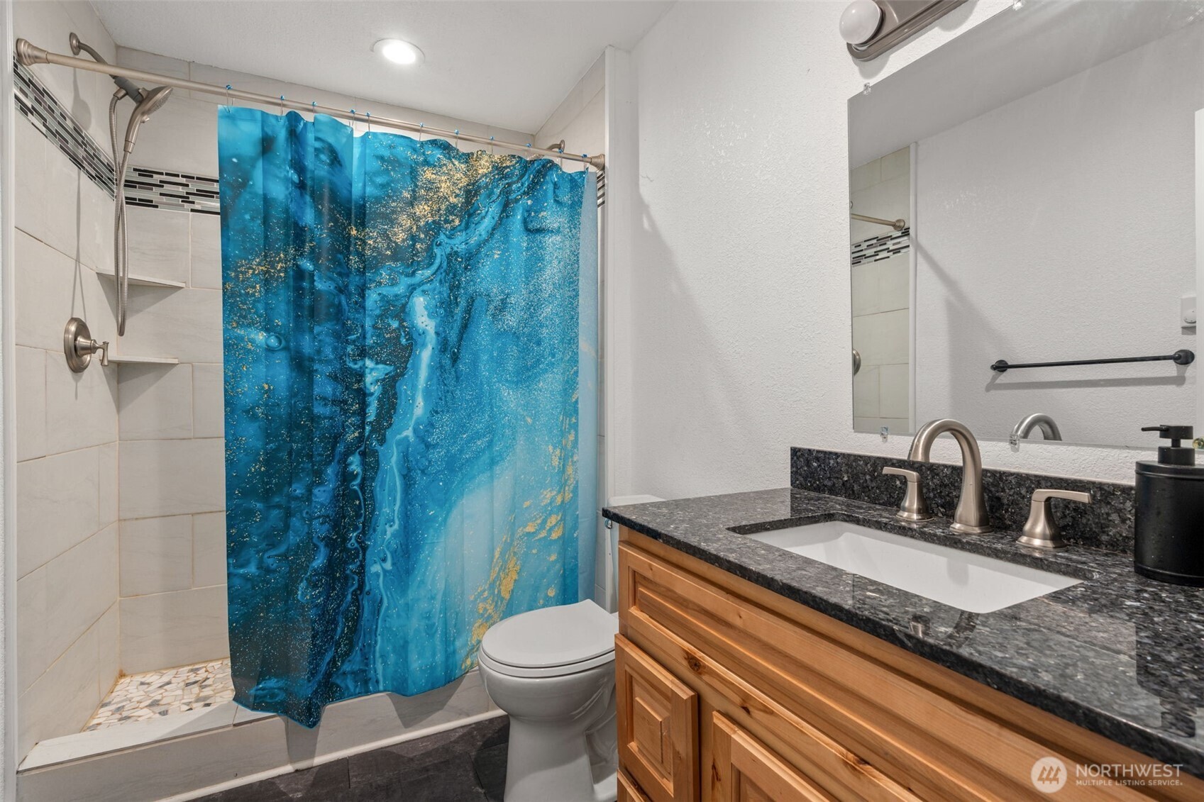 226 Southwest Lewis Street Chehalis, WA 98532 - Photo 22 of 27 a bathroom with a granite countertop sink toilet and shower