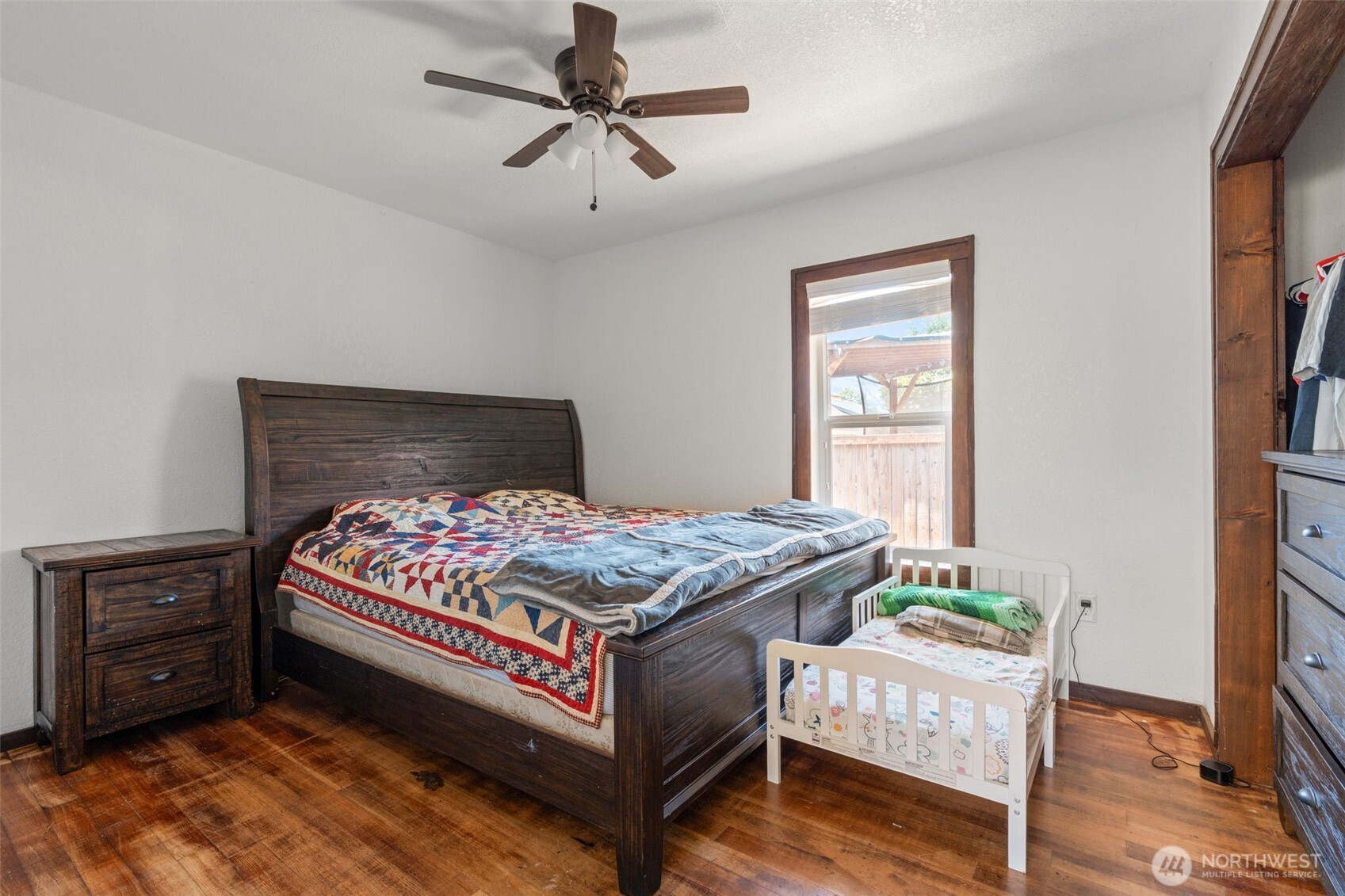 226 Southwest Lewis Street Chehalis, WA 98532 - Photo 23 of 27 a bedroom with a bed a dresser and a window